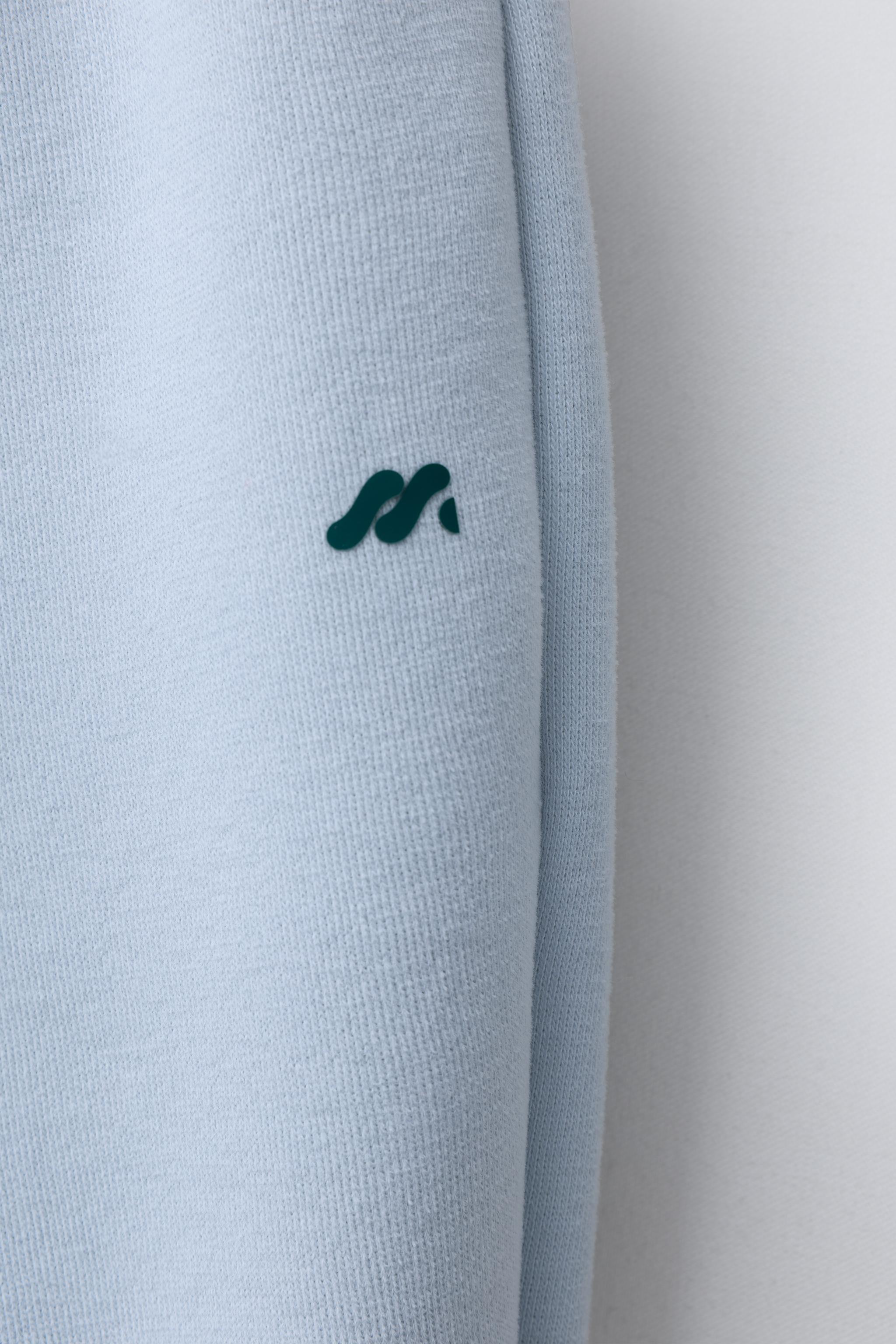 FLEECE LINED BAGGY PANTS WITH LOGO